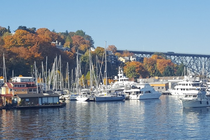 a boat is docked next to a body of water