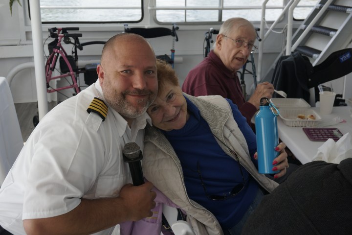 a man and a woman sitting on a table