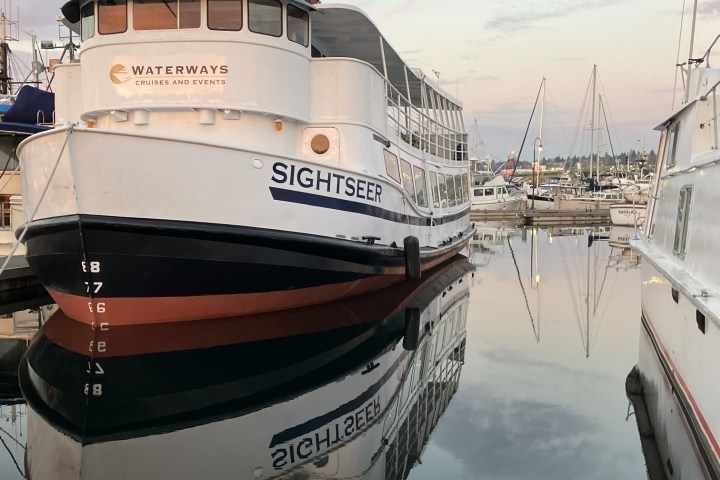 a boat is docked next to a body of water