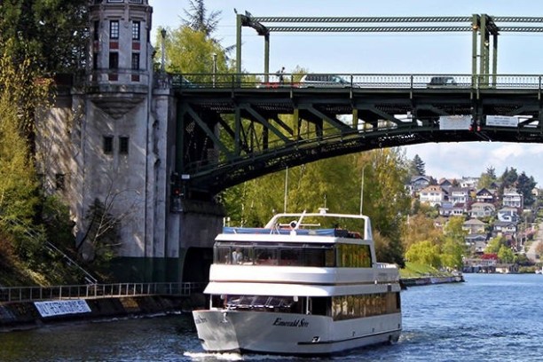 a train crossing a bridge over a body of water