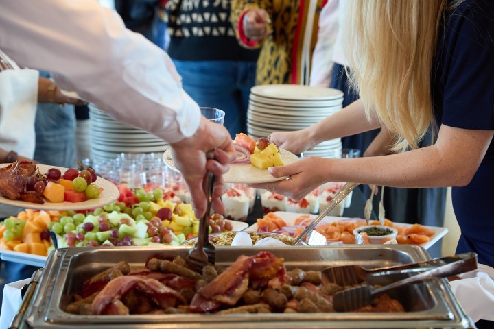 a group of people preparing food inside of it
