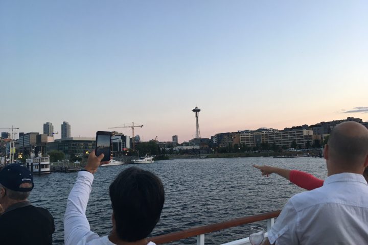 a man standing next to a body of water