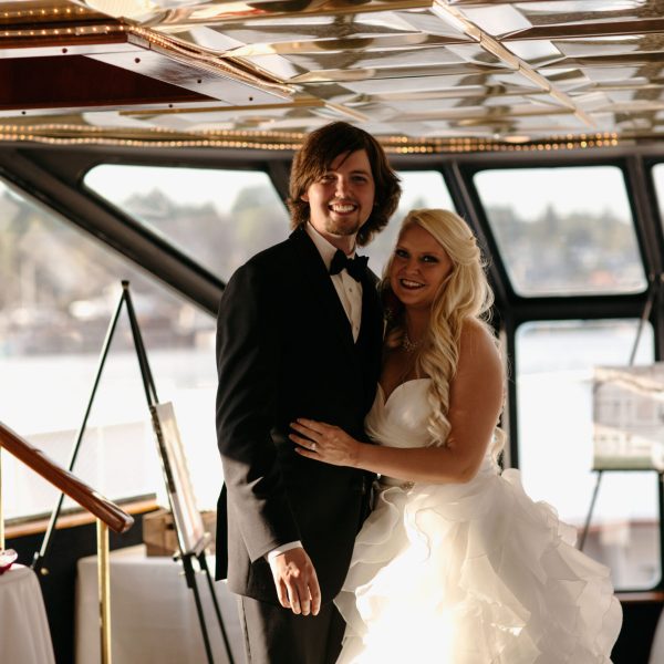 a man and a woman standing in front of a window