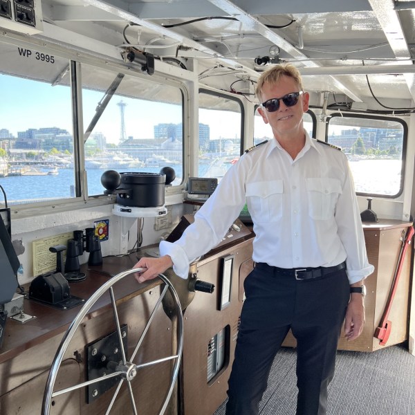 a man standing in front of a plane