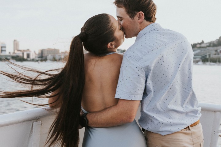 a person standing in front of a bridge