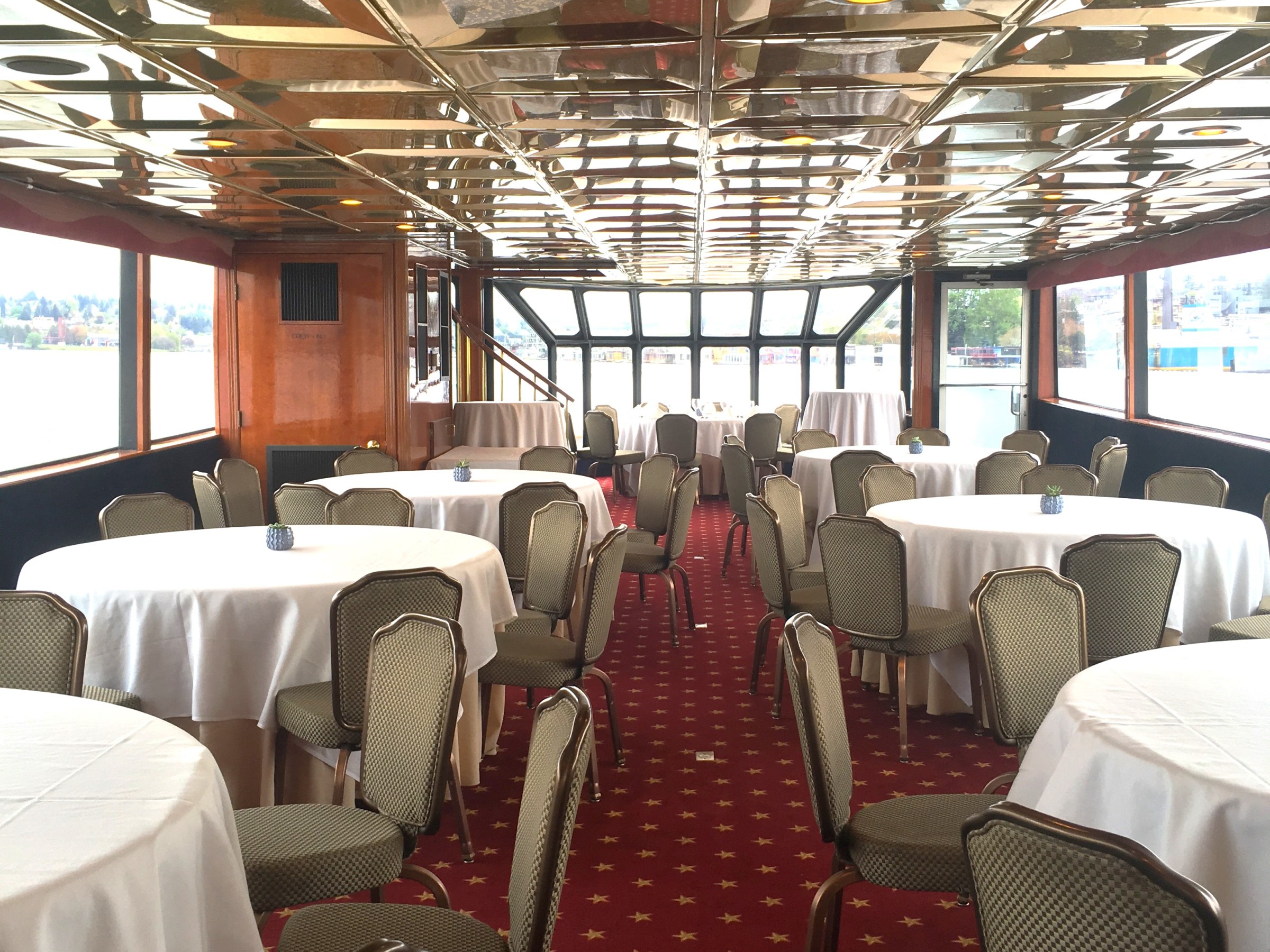 a bedroom with a bed and a chair in a room